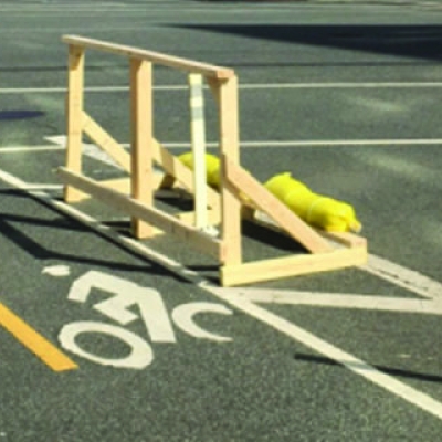 Wooden handstand on bike lane. Photo by DCDOTRA.